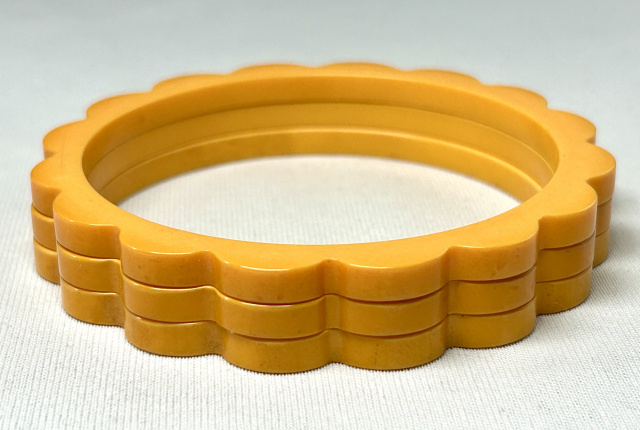BS56 trio solid marigold bakelite daisy spacer bangles